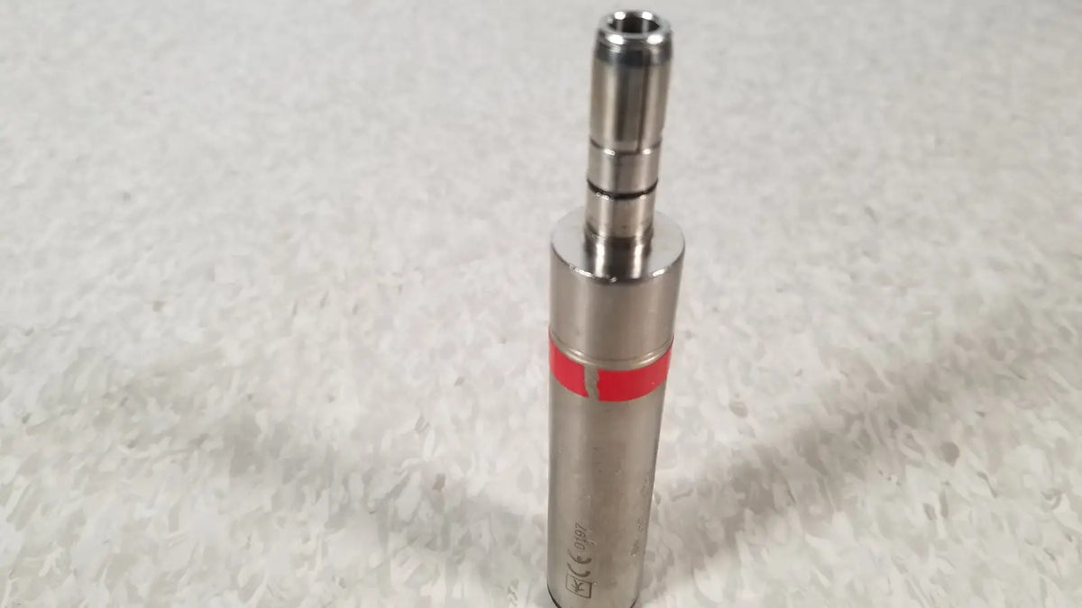 Silver metallic cylindrical stryker instruments handswitch tps microdrill with red band and threaded top section