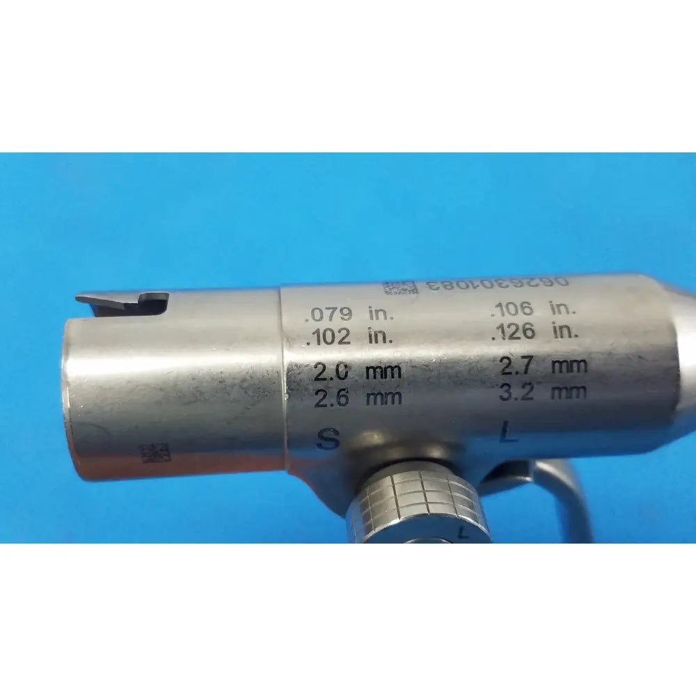 Silver metallic caliper with engraved inch and millimeter markings for precise measurement by stryker instruments pin collet