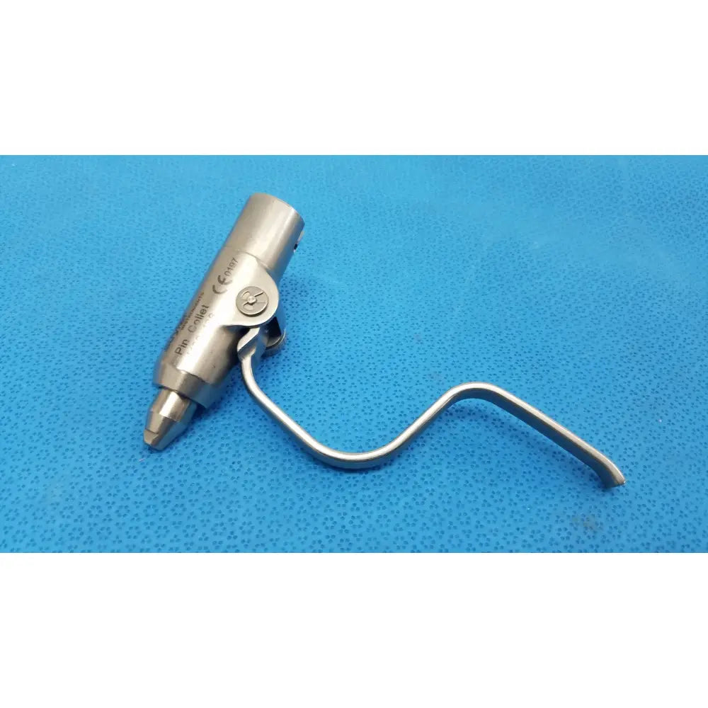Stainless steel stryker instruments pin collet 4100-126 with curved handle and cylindrical tip featuring engraved stryker branding