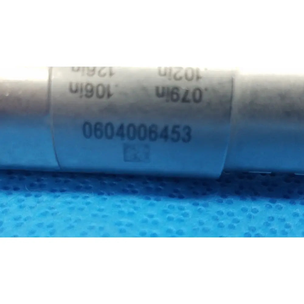 Silver cylindrical capacitor with serial number on stryker instruments pin collet 4103-126 for precise instrument use