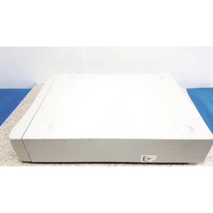 White plastic stryker iswitch wireless universal foot control pedal with rounded edges and a triangular sticker on front side