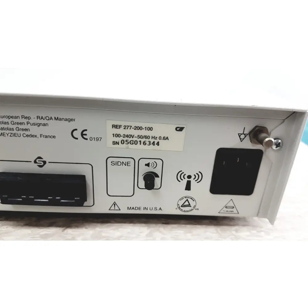 White stryker iswitch wireless universal foot control pedal with black power input and ce mark made in usa backside view