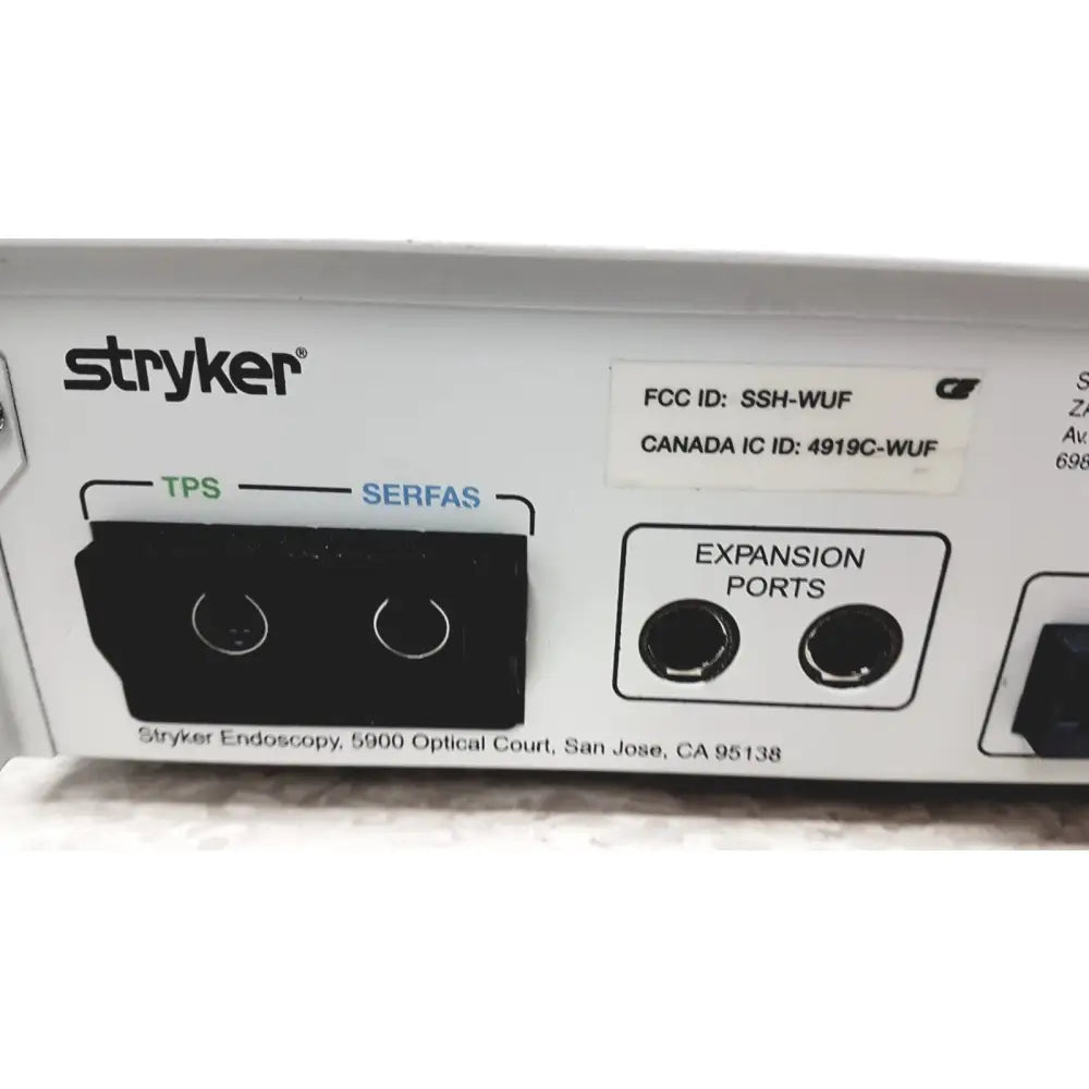 White stryker iswitch wireless universal foot control pedal showing black tps and serfas ports with right side expansion ports