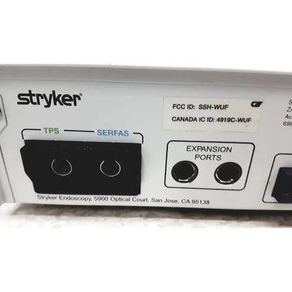 White stryker iswitch wireless universal foot control pedal showing black tps and serfas ports with right side expansion ports