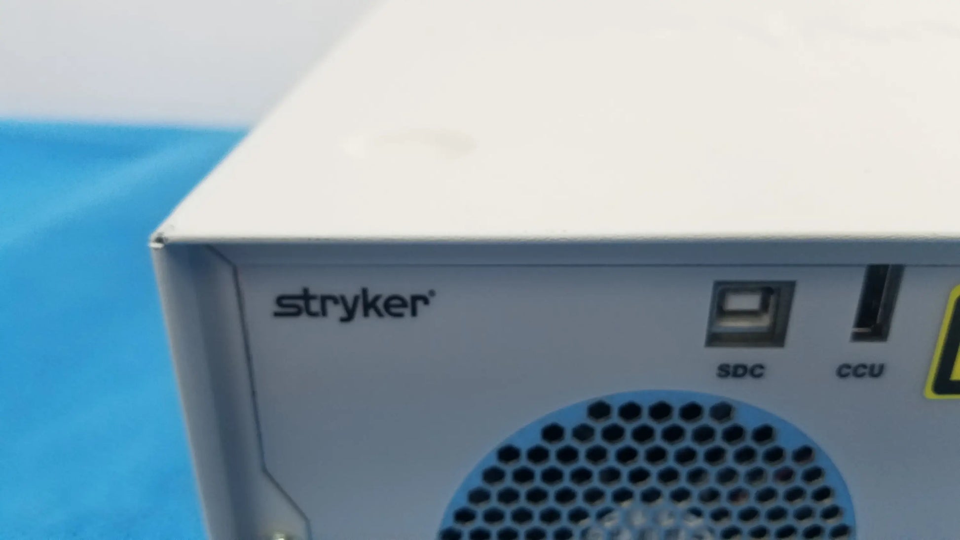 White stryker l10 led light source with aim advanced imaging back side showing usb sd ports and perforated ventilation grille
