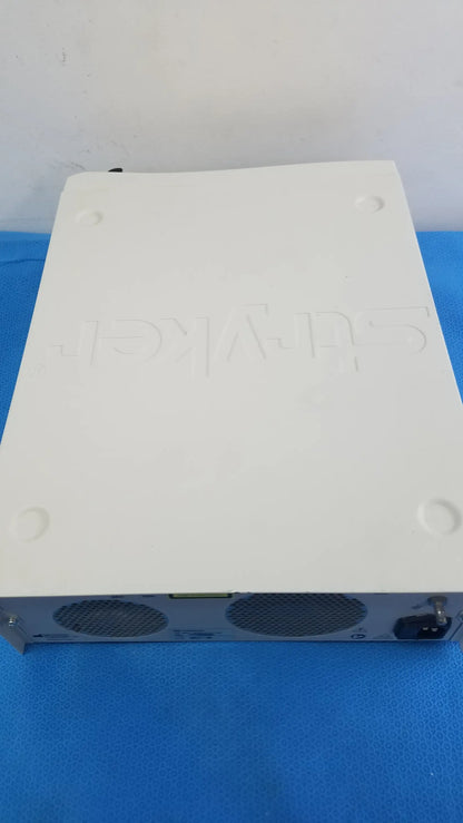 White plastic dell wyse thin client device with ventilation grilles shown with stryker l10 led light source with aim advanced imaging modality