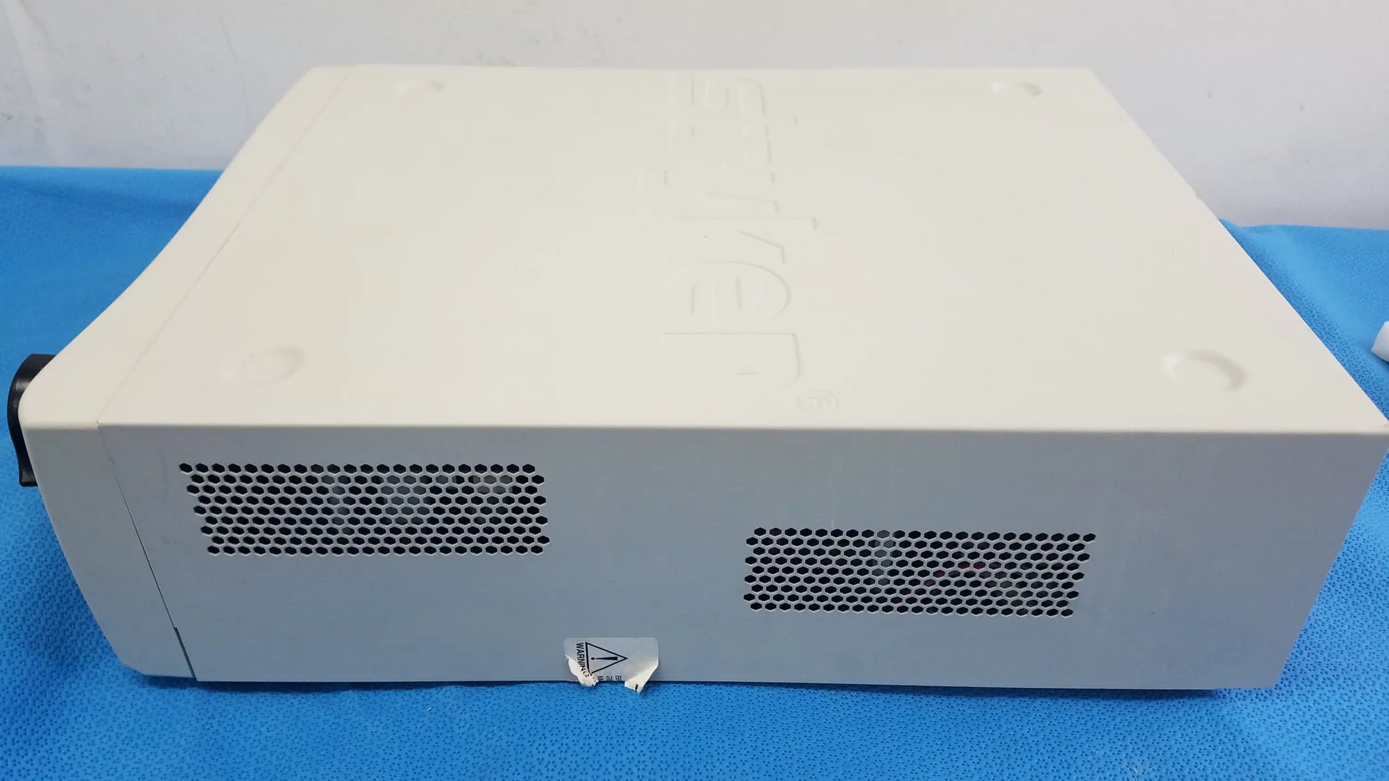 Off-white rectangular stryker l10 led light source with perforated ventilation grilles featuring aim advanced imaging modality