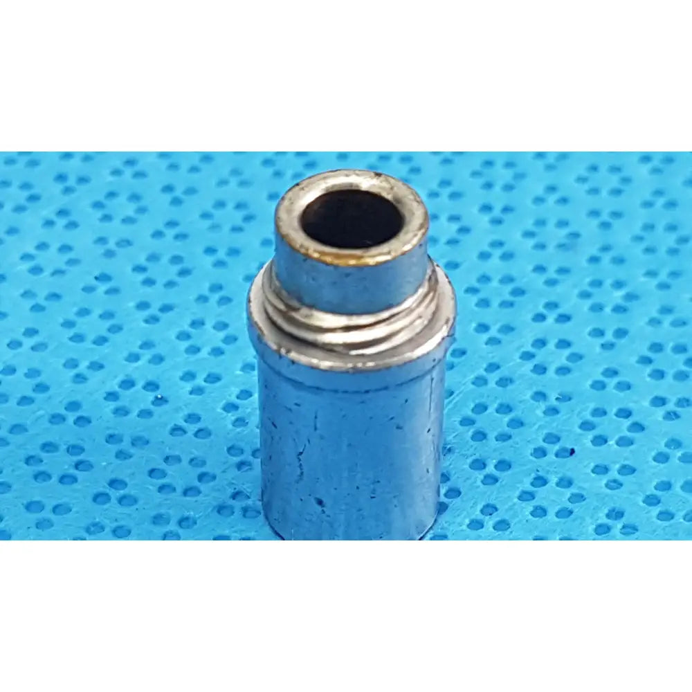 Silver metallic cylindrical stryker light post adapter with threaded collar and slight tarnish for fiber optic cables