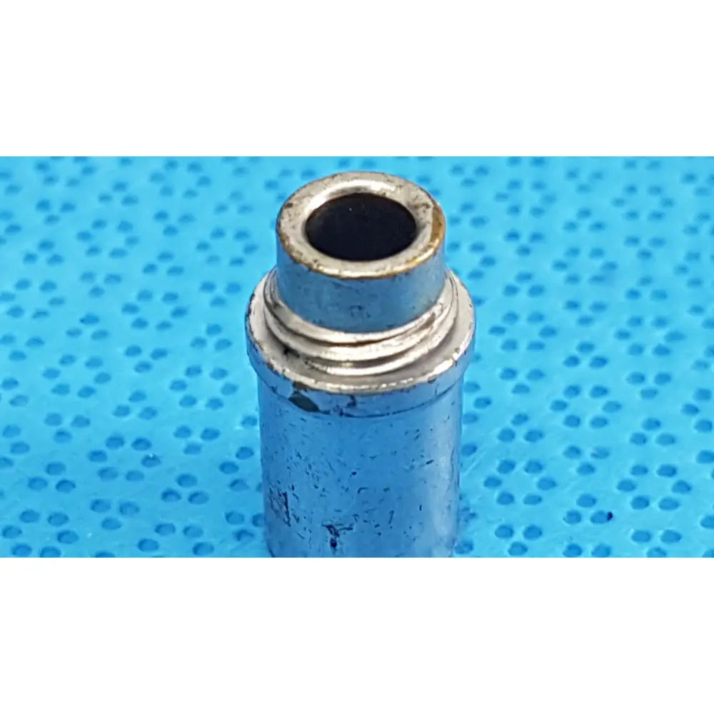Silver metallic stryker light post adapter with threaded top and worn surface for storz and olympus fiber optic cables