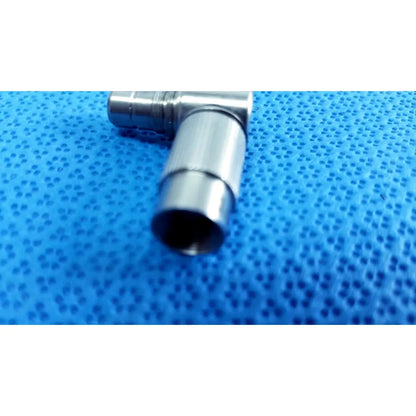 Silver-colored metal t-shaped connector from stryker lot autoclavable 10mm 134ºc scope with polished reflective surface