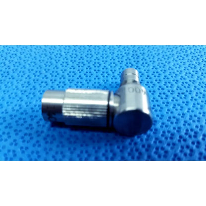 Silver metallic right-angle connector with threaded ends and engraved markings in stryker lot autoclavable 10mm 134ºc set