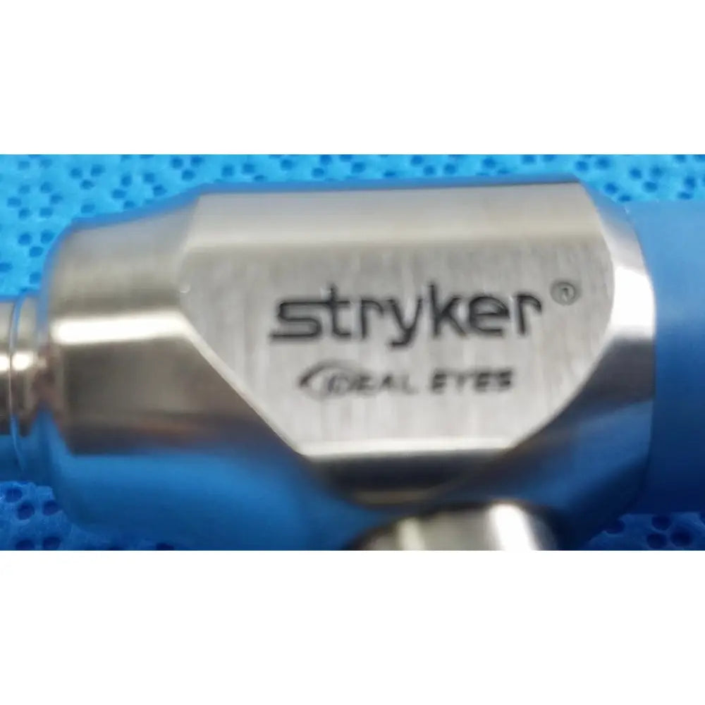 Silver metallic stryker lot autoclavable 10mm 30º scope with brushed finish and blue protective cover in sterilization tray