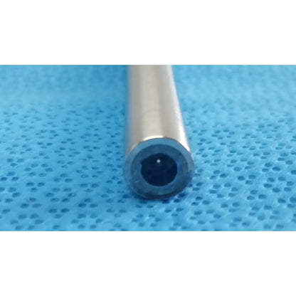 A sleek metallic cylindrical tube with a polished silver exterior and dark interior stryker lot autoclavable 10mm 30º scope