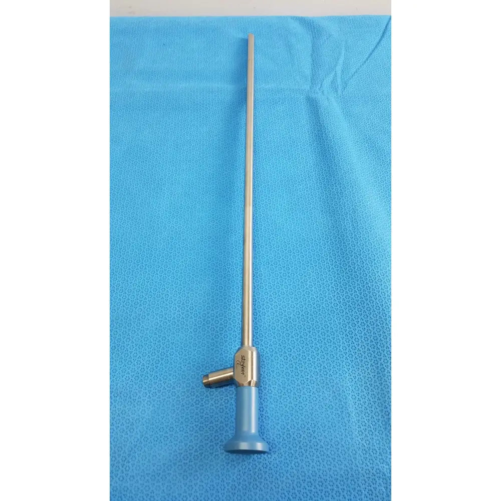 Silver surgical endoscope with blue handle and engraved branding on metallic joint from stryker lot autoclavable 134ºc scope