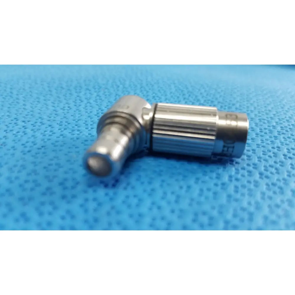 Stainless steel right-angle connector with ribbed grip and engraved markings in stryker lot autoclavable 134ºc scope set