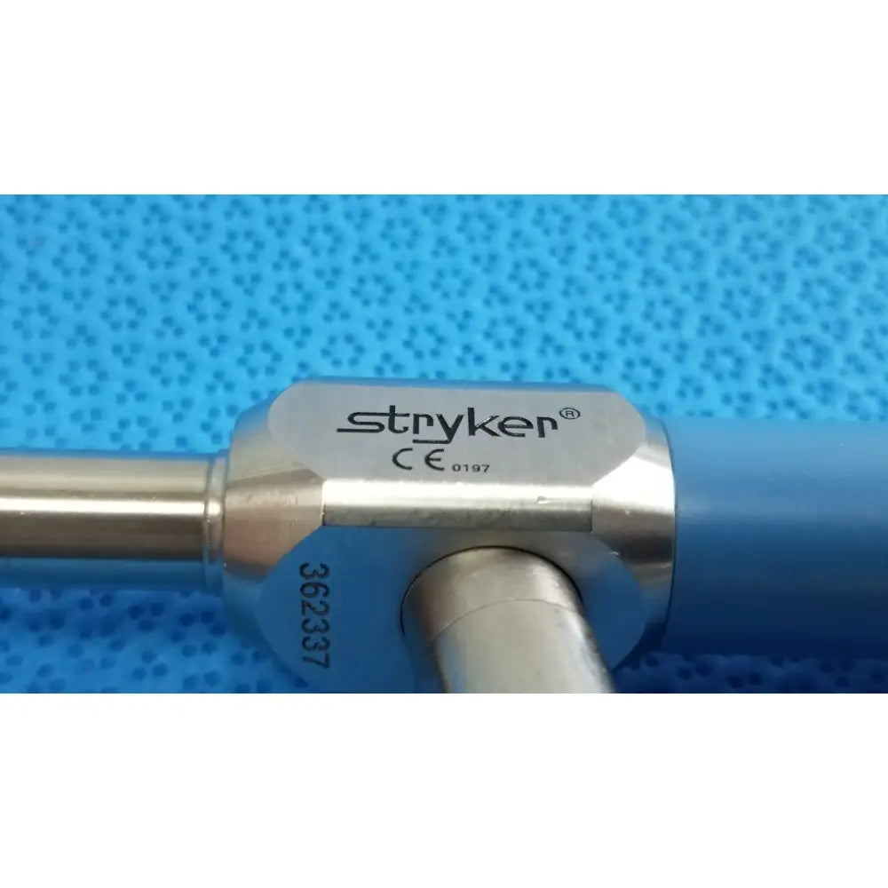 Silver stryker surgical instrument with blue handle and engraved model number in autoclavable 134ºc scope lot