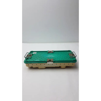 Green perforated surgical instrument tray with beige base and metallic latches for stryker optional instrument ray gamma3 system