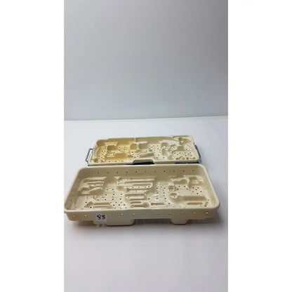 Cream-colored plastic stryker optional instrument tray with molded compartments and perforated sides for instrument ray gamma3 system