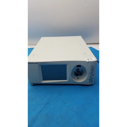 White rectangular stryker pneumo high flow insufflator with small screen and circular lens for medical use