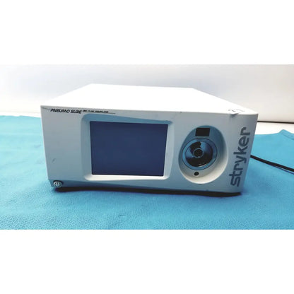 White stryker pneumo sure xl high flow insufflator with rectangular screen and circular lens front for surgical use