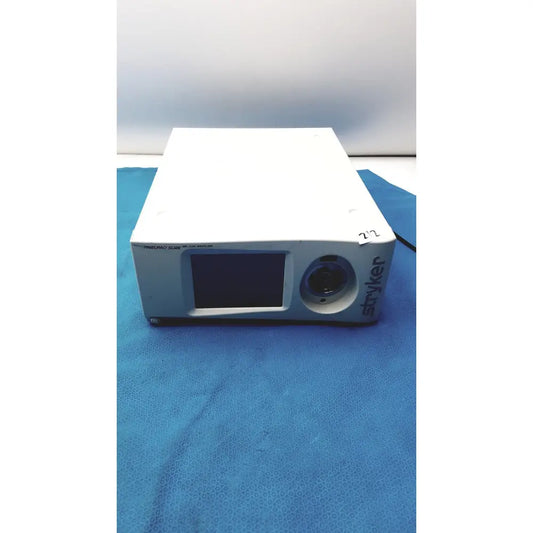 White rectangular stryker pneumo high flow insufflator with small screen and circular lens for medical use