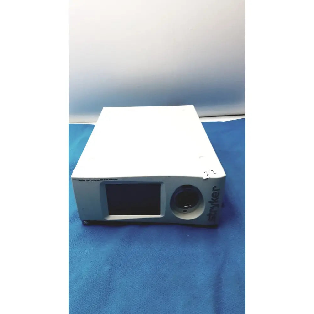 White rectangular stryker pneumo high flow insufflator with small screen and circular lens for medical use