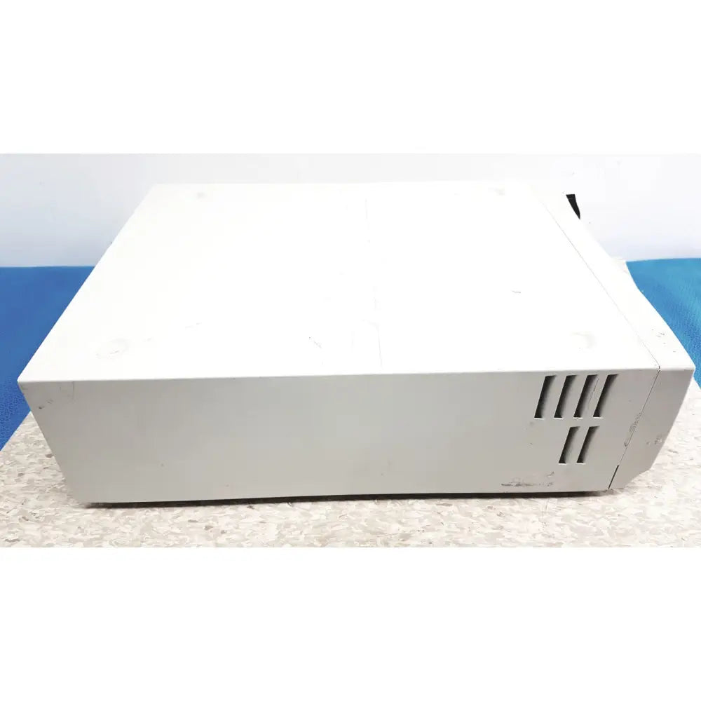 White rectangular stryker precision light source with matte finish and vertical slotted vents on the side