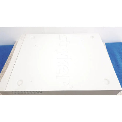White plastic sony receiver with embossed logo and ventilation slots on the back of stryker precision light source unit