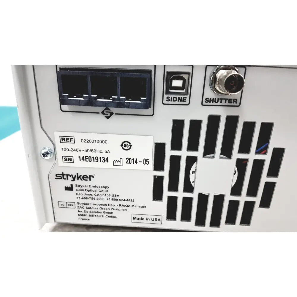 White stryker precision light source power supply unit with black ventilation slots and labeled ports backside view