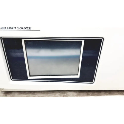 White stryker precision light surgical illumination unit with rectangular display framed by black and silver borders