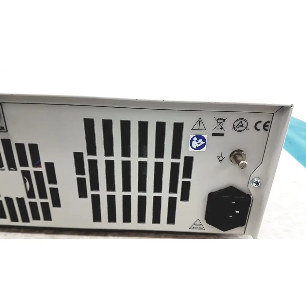Silver metallic stryker precision light source power supply unit with black ventilation slats and hexagonal ac input plug backside view