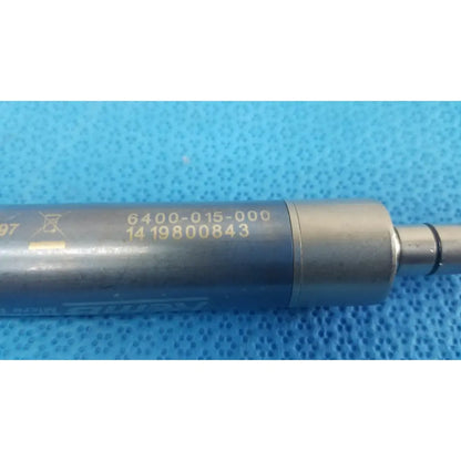 Gray metallic cylindrical stryker remb electric micro drill handpiece with engraved serial numbers and shur logo