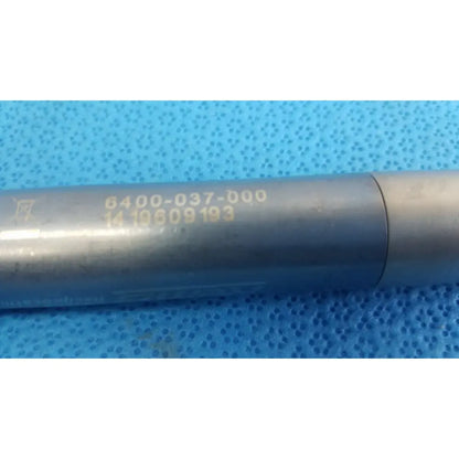 Silver metallic cylindrical tool with engraved serial number and model code for stryker remb electric reciprocating saw