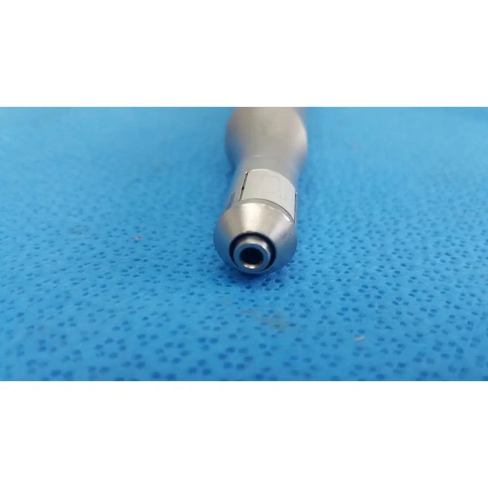 Silver dental handpiece with polished metallic finish and tapered design for stryker remb electric reciprocating saw use