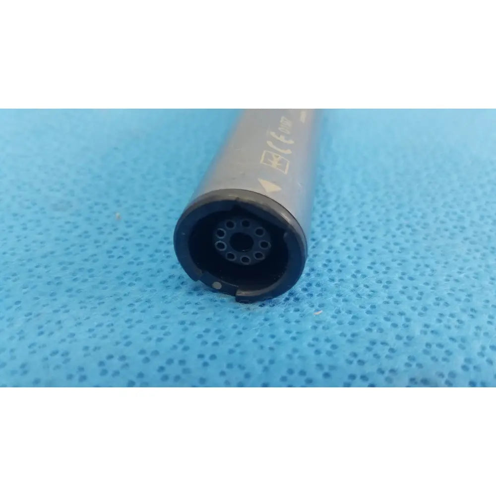 Gray cylindrical stryker remb electric reciprocating saw with black circular end featuring multiple holes and certification marks