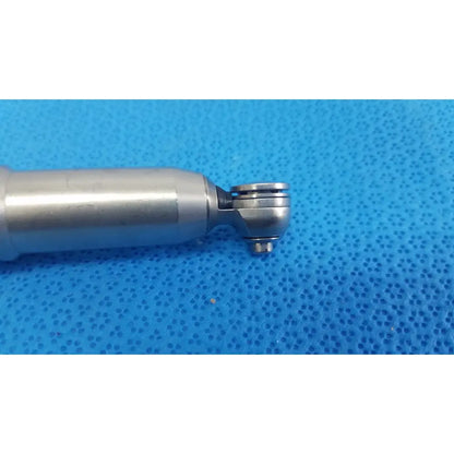 Silver-colored metallic dental handpiece with cylindrical body and articulated joint from stryker remb electric sagittal saw