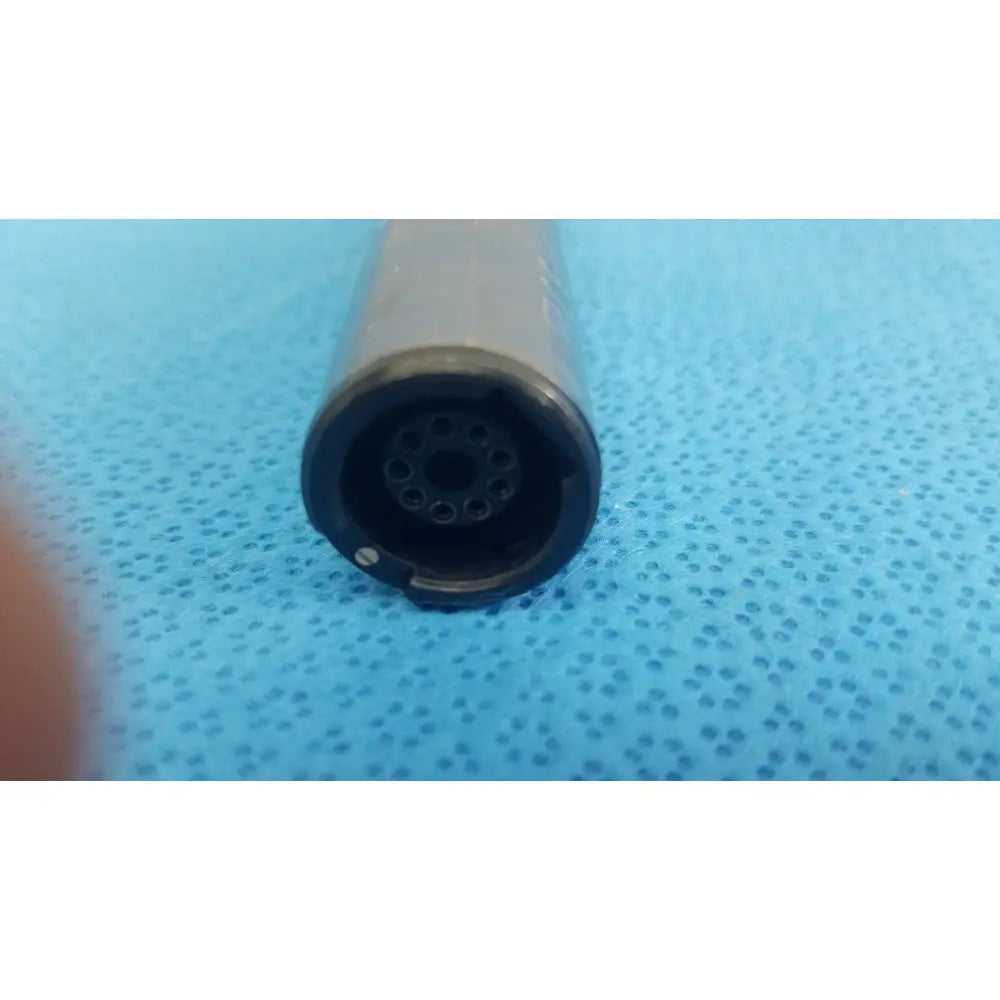 Gray cylindrical connector with black circular end and multiple holes for stryker remb electric sagittal saw 6400-034-000