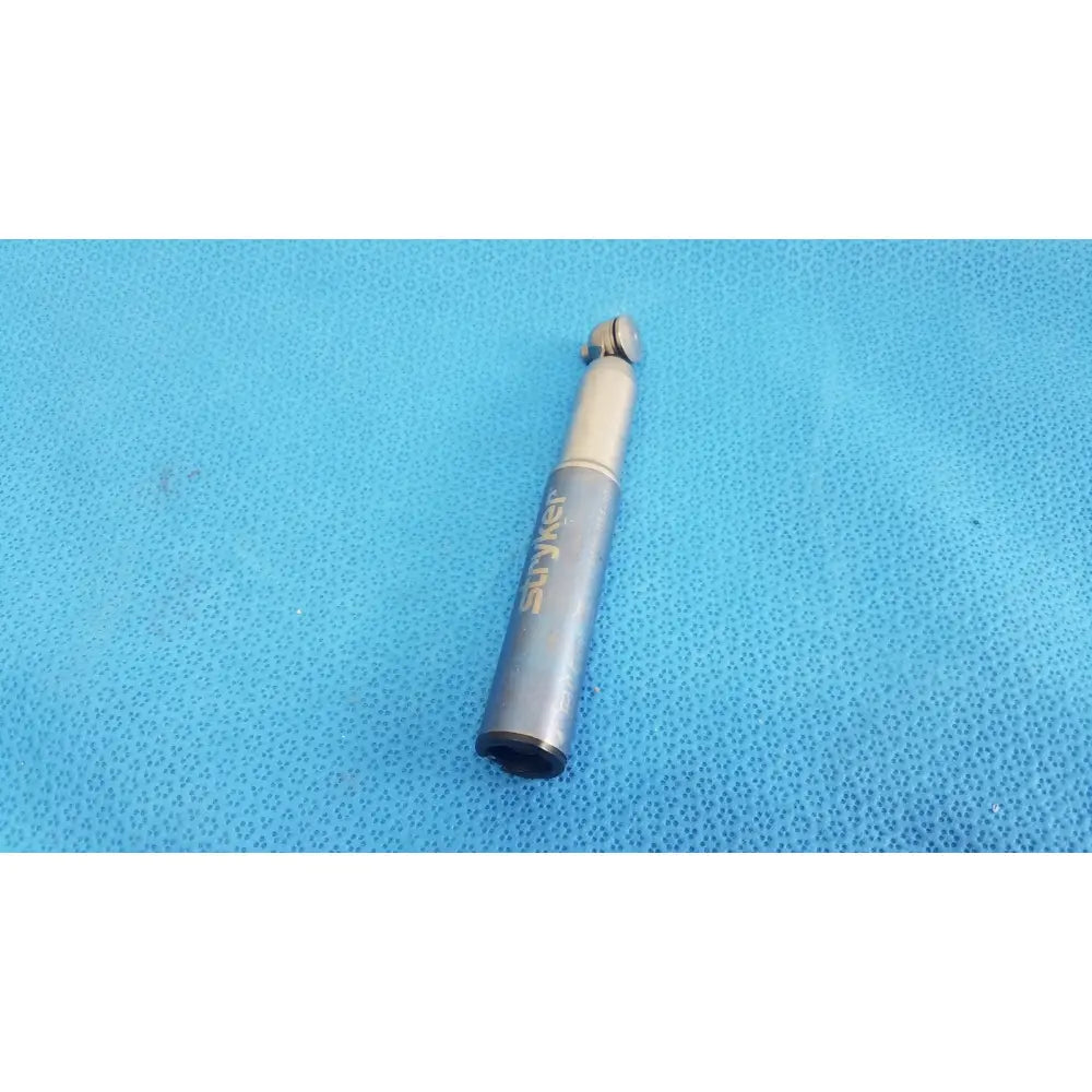 Gray metal stryker remb electric dental handpiece with gold-colored branding and rounded tip for precise cutting