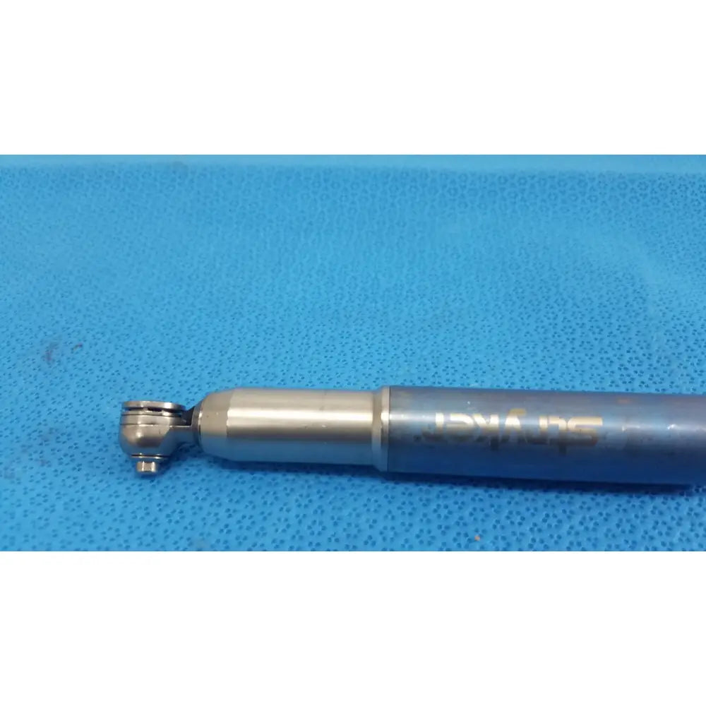 Silver-colored metal stryker remb electric sagittal saw with textured grip and engraved branding for precise surgical use