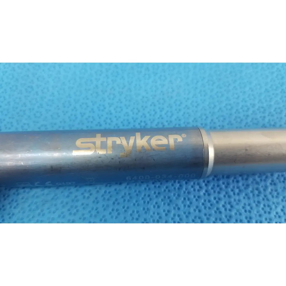 Stryker remb electric sagittal saw with metallic silver body and gold-colored branding for precise surgical use