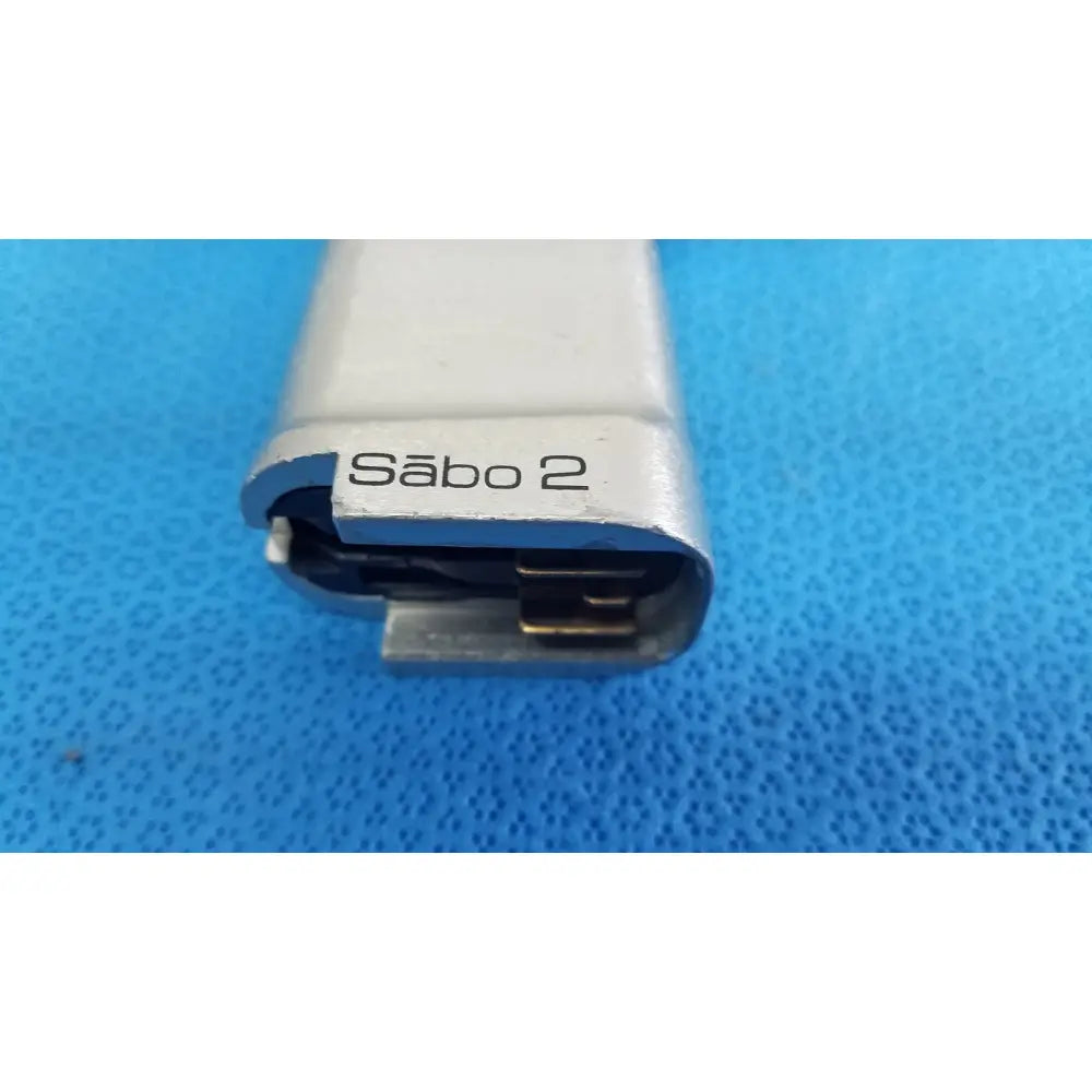 Silver-colored metal stryker sago 2 surgical orthopedic reciprocating saw power tool with visible internal components
