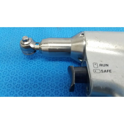 Silver metallic stryker sago 2 surgical orthopedic reciprocating saw power tool with black safety switch labeled run and safe