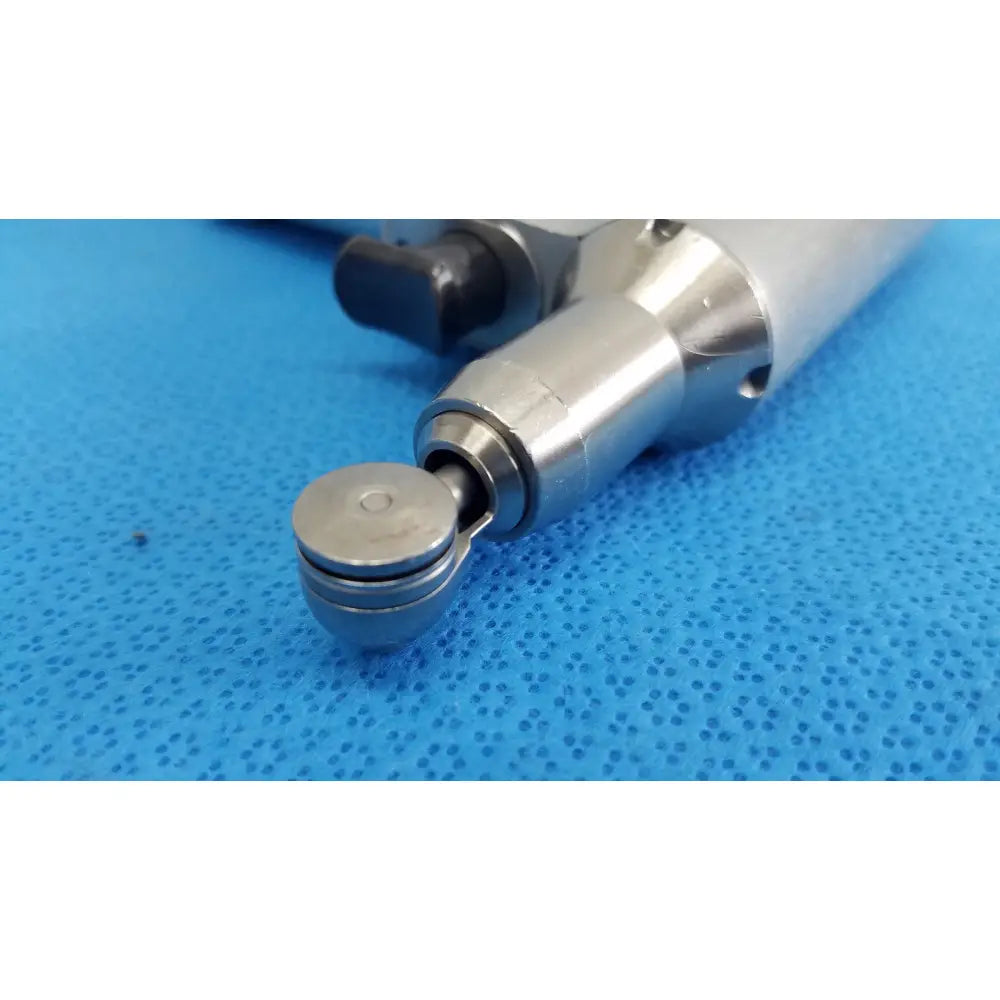 Silver metallic stryker sago 2 surgical orthopedic reciprocating saw power tool with black ergonomic handle
