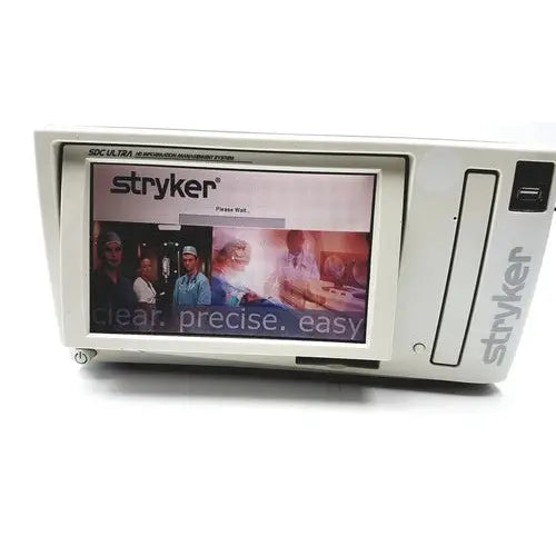 White stryker sdc ultra hd information management system with touchscreen displaying brand logo and promotional imagery
