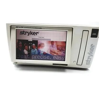White stryker sdc ultra hd information management system with touchscreen displaying brand logo and promotional imagery