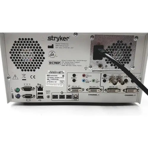 Silver metallic back side of stryker sdc ultra hd information management system with multiple ports and ventilation grilles