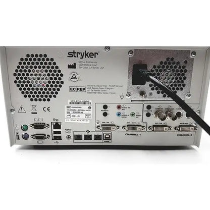 Silver metallic back side of stryker sdc ultra hd information management system with multiple ports and ventilation grilles
