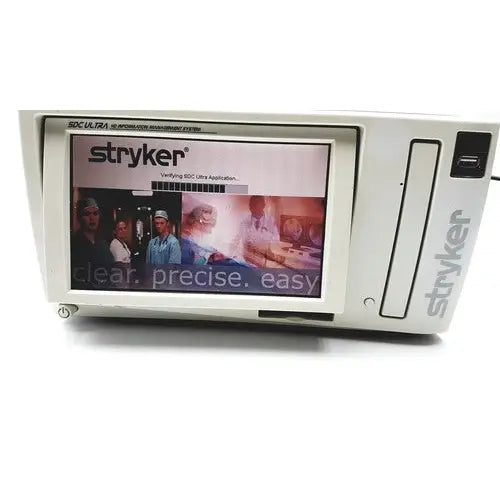 White stryker sdc ultra hd information management system with touchscreen displaying brand logo and application interface