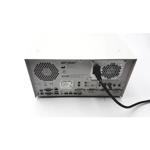 Back view of white stryker sdc ultra hd information management system featuring metallic panel with ventilation grilles and ports