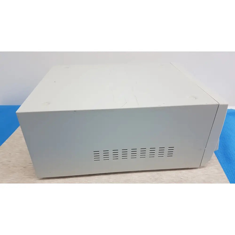 Off-white rectangular stryker sdc3 hd digital capture unit with horizontal ventilation slits on side for information management